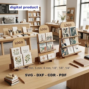 May include: Three wooden tiered display stands for greeting cards, each featuring a top header with the text LOGO. The stands are designed for material thicknesses of 3 mm, 4 mm, 5 mm, 6 mm, 1/8 inch, 1/6 inch, and 1/4 inch, available as SVG, DXF, CDR, and PDF files.