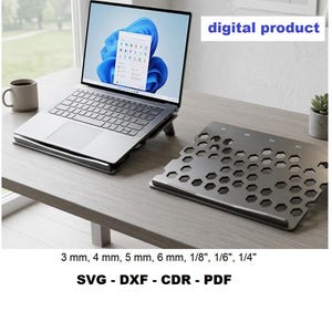 May include: A digital product featuring a black laptop stand with a hexagonal cutout pattern. The stand is shown supporting a laptop and as a separate piece. Text includes "digital product" and "3 mm, 4 mm, 5 mm, 6 mm, 1/8", 1/6", 1/4" SVG - DXF - CDR - PDF".