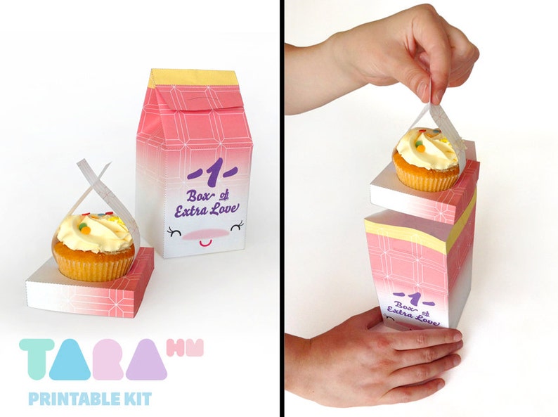 May include: A pink and white cardboard box with a smiling face and the text "1- Box of Extra Love" printed on it. The box is designed to hold a cupcake, which is shown being lifted out of the box. The box is part of a printable kit.