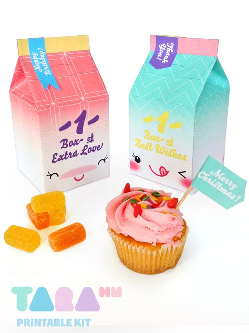 May include: Printable party favor boxes with cute cartoon faces and text that says "Box of Extra Love" and "Box of Best Wishes". The boxes are pink and blue with a gradient effect. There are also some orange candies and a cupcake with pink frosting and sprinkles.