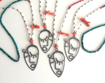 Coral Beads Necklace with Sterling Silver Abstract Face Pendant