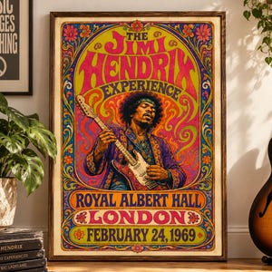 May include: A rectangular poster featuring a psychedelic illustration of Jimi Hendrix playing an electric guitar. The text reads The Jimi Hendrix Experience, Royal Albert Hall, London, February 24, 1969. The design uses vibrant pink, yellow, and blue colors.