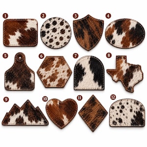May include: A collection of twelve patches featuring various geometric and organic shapes, including a rectangle, circle, shield, oval, tag, hexagon, arch, Texas outline, mountain, heart, diamond, and rounded rectangle, all with brown, white, and black cowhide.