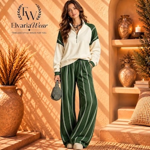 May include: A cream-colored long-sleeve pullover with a quarter-zip neckline and green raglan sleeves, paired with wide-leg green trousers featuring vertical white stripes. The text ElvariaWear is visible in the upper left corner.
