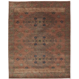 May include: A rectangular area rug featuring a deep terracotta red background with a central vertical row of three large, dark blue and olive green geometric medallions. The border displays intricate floral and linear patterns in muted tones.
