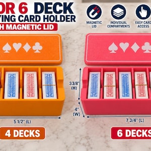 May include: Two rectangular playing card holders with magnetic lids, one orange for 4 decks and one pink for 6 decks. The orange holder measures 5.5 inches long, 4 inches wide, and 3.375 inches high. The pink holder is 7.75 inches long, 4 inches wide, and 3.375 inches high.