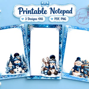 May include: Three printable notepad designs in 4x6 inch format featuring winter themes. Each sheet has a white center with blue borders decorated with snowflakes, snowmen, a reindeer, and a blue truck carrying gifts. Text reads Printable Notepad.
