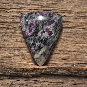 May include: A set of three ceramic mugs with a speckled, matte finish. The mugs are in shades of cream, light gray, and dark gray. Each mug has a simple, minimalist design, perfect for coffee or tea.