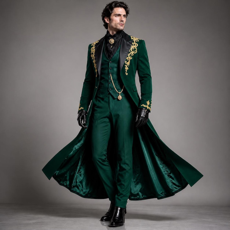 May include: A dark green long coat with gold embroidery on the lapels and cuffs, paired with a matching vest and trousers. The ensemble includes a black shirt, a gold brooch, a gold chain accessory, and black gloves, creating a formal look.