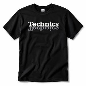 May include: A black short-sleeved t-shirt featuring the word Technics printed in white across the chest, with a mirrored reflection of the text printed directly below it in a lighter grey shade. The shirt has a crew neckline and a standard fit.