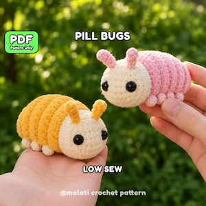 May include: Two crocheted pill bug toys, one in yellow and one in pink, each with a cream-coloured head, black bead eyes, and small antennae. The image includes the text PILL BUGS, PDF Pattern Only, LOW SEW, and @melati crochet pattern.