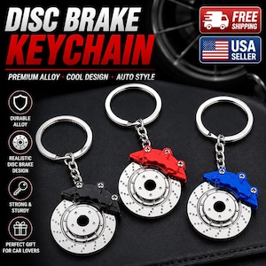 May include: Three metal disc brake keychains featuring a silver-colored rotor with drilled holes and a brake caliper in black, red, or blue. Each keychain includes a circular split ring attached by a short metal chain, showcasing a realistic automotive design.