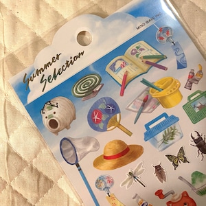 May include: A sheet of stickers featuring summer-themed illustrations, including a dragonfly, a hat, a fan, a bug, a net, a bottle of soda, a wind chime, a book, a paintbrush, a bucket, a jar, a bug, a fan, a piggy bank, a bug, a bug, a bug, and a cat. The sheet is labeled "Summer Selection" and "Mind Wave Inc."