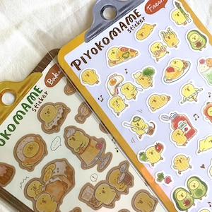 May include: Two sets of stickers featuring cute cartoon chicks in various poses and settings. The stickers are on a light purple background and are labeled "Piyokomame Fresh Sticker" and "Ukomama Sticker Baker".