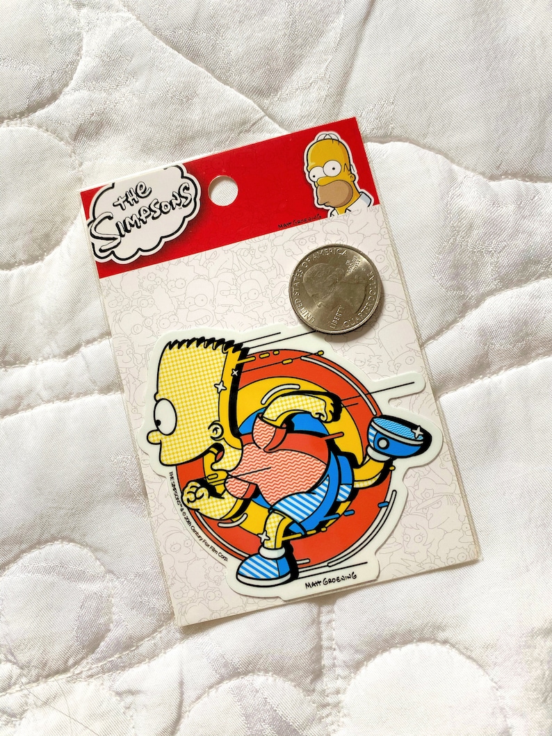 May include: A yellow and blue sticker featuring a cartoon character running in a circle. The character is wearing a red and blue shirt and blue pants. The sticker is labeled "The Simpsons" and "Matt Groening".