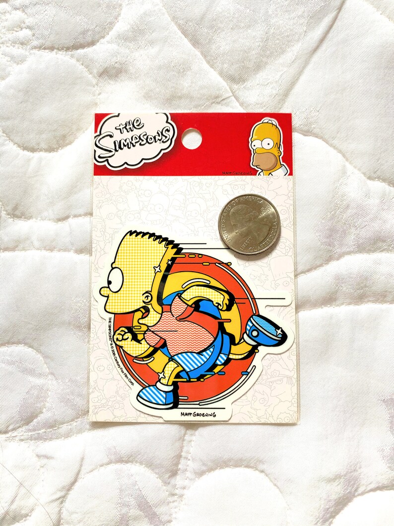 May include: A yellow and blue sticker featuring a cartoon character running in a circle. The character is wearing a red and blue shirt and blue pants. The sticker is labeled "The Simpsons" and "Matt Groening".