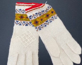 White gloves made of fine woolen yarn with an ornament