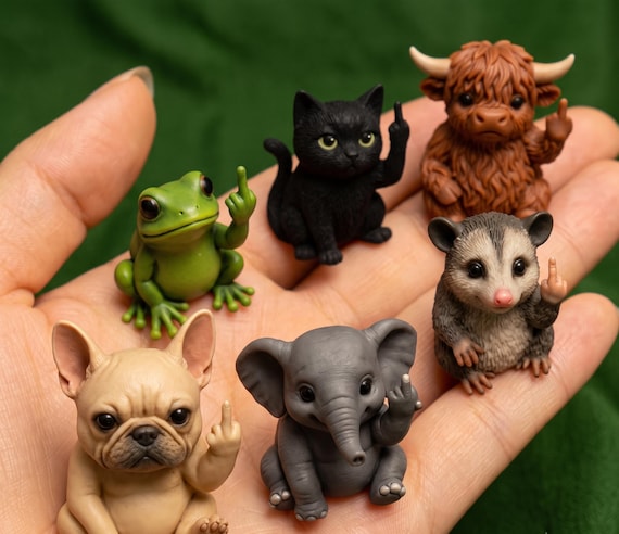 Tiny resin animal figurines with sarcastic/cheeky expressions that actually make you do a double-take — the kind of desk decor that sparks a conversation.