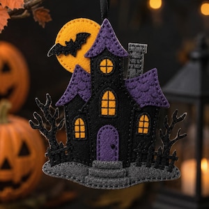 May include: A felt hanging ornament shaped like a haunted house with a black structure, purple roof, and purple door. It features yellow windows, a grey chimney, a grey base, and a yellow moon background with a black bat silhouette attached.