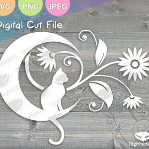 May include: White silhouette of a cat sitting inside a crescent moon with a floral design. The design includes a large flower, smaller flowers, and leaves.