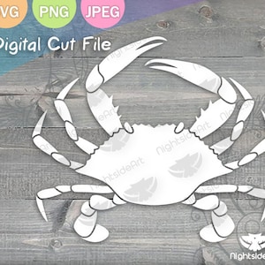 May include: A white silhouette of a crab with eight legs and a large body. The crab is facing to the right and is on a gray wooden background.
