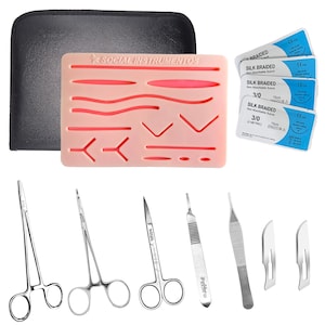 May include: A suture practice kit featuring a rectangular peach-colored silicone pad with various pre-cut incisions, a black zippered case, four packs of 3/0 silk braided non-absorbable sutures, two needle holders, scissors, a scalpel, and tweezers.
