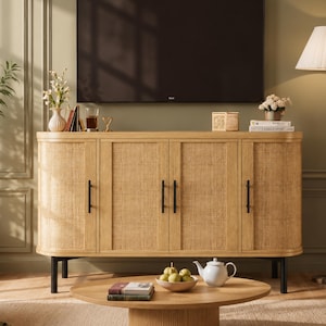 May include: A light wood sideboard featuring four doors with woven cane panels and vertical black metal handles. The unit stands on four black cylindrical legs and is positioned beneath a large flat-screen television mounted on a wall.