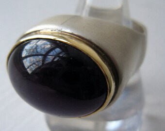 Designer made silver ring with gold bezel