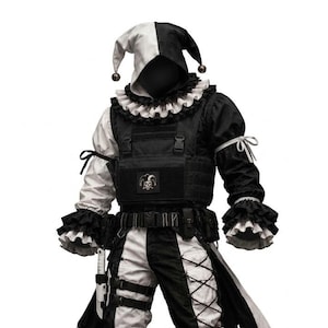 May include: A black and white jester costume featuring a hooded cap with bells, a ruffled collar, and cuffs. The outfit includes a tactical vest with a skull patch, lace-up trousers with side straps, and black and white boots. The design is split colour.