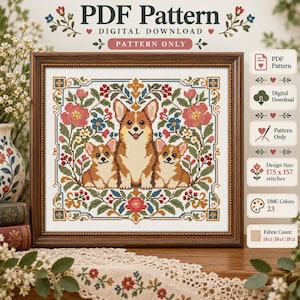 Op de afbeelding: Een kruissteekpatroon met drie Corgi-honden omringd door een bloemenrand met rode, roze en blauwe bloemen. De tekst luidt PDF Pattern, Digital Download, Pattern Only, Design Size 175 x 157 stitches, 23 DMC Colors.