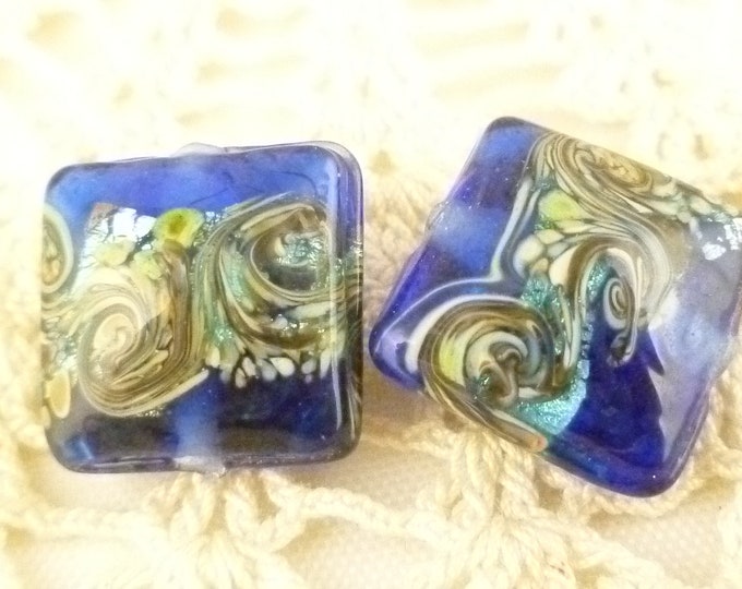 Image showcasing 14mm Navy Blue Wavy Swirl Lampwork Beads, Ocean Waves Square Pillow ...