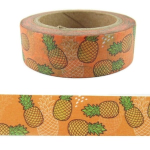 May include: A roll of orange washi tape with a repeating pattern of yellow pineapples on a white background.