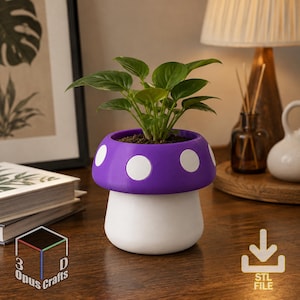 May include: A mushroom-shaped planter with a purple cap featuring white circular spots and a solid white base. The planter contains a small green leafy plant. The text 3D Opus Crafts and a download icon with the text STL FILE are visible.
