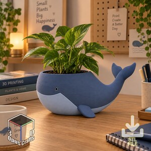 May include: A matte blue whale-shaped planter with a light blue underbelly and a small eye detail. The planter holds a green pothos plant with variegated leaves. The whale has a curved tail and side fins, designed as a decorative container.