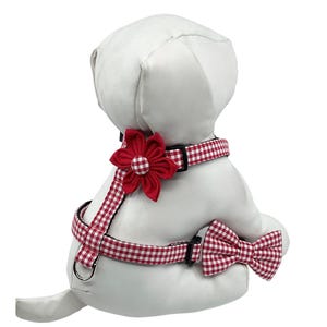 Red Gingham Dog Harness With Optional Flower Or Bow Tie, Adjustable Pet Harness Sizes XS, S, M. All straps are sewn on top of black webbing to prevent the fabric from stretching out. I use light interfacing, plastic triglide slides to adjust the size, quality nickel plated d rings and a  side release buckle. The red flower and matching gingham bow tie are attached with double sided hook and loop for easy on and off.