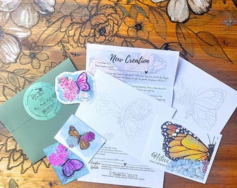 May include: A collection of paper items including a green envelope with a circular sticker, a butterfly sticker, two small butterfly art prints, and three white sheets featuring butterfly line art and text titled New Creation and Notice.