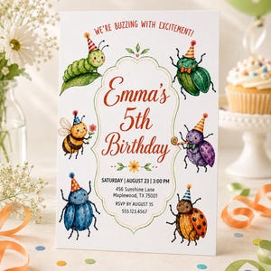 May include: A white rectangular birthday invitation card featuring colorful watercolor illustrations of insects wearing party hats. The text reads: We're buzzing with excitement! Emma's 5th Birthday, Saturday, August 23, 3:00 PM, 456 Sunshine Lane, Maplewood, TX 75001, RSVP by August 15, 555.123.4567.