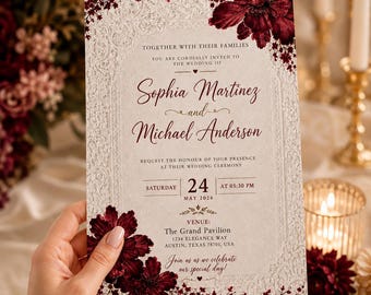 Könnte beinhalten: Eine rechteckige Hochzeitseinladungskarte mit cremefarbenem Hintergrund, weißem Spitzenrand in Reliefoptik und dunkelroten Blumenakzenten. Der Text lautet: Together with their families, you are cordially invited to the wedding of Sophia Martinez and Michael Anderson, Saturday, 24 May 2026, at 05:30 PM, The Grand Pavilion, 1234 Elegance Way, Austin, Texas 78701, USA. Join us as we celebrate our special day!