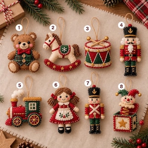 May include: Eight felt Christmas ornaments featuring a brown bear, a rocking horse, a drum, a nutcracker, a steam train, a doll with pigtails, a soldier, and a jack-in-the-box. Each ornament has a hanging loop and numbered white circular labels.