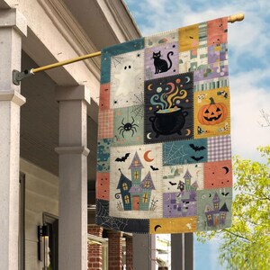 May include: A rectangular garden flag featuring a patchwork design with Halloween motifs including a white ghost, a black cat, a spider, a black cauldron with colorful smoke, a jack-o'-lantern, bats, and haunted houses in shades of orange, purple, and blue.