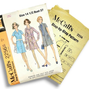 May include: Vintage McCall's sewing pattern, size 14 1/2, bust 37. The pattern features illustrations of women's dresses with a scarf. The package is white with orange and black text. Includes step-by-step instructions.