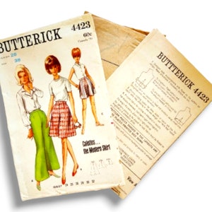 May include: Vintage Butterick sewing pattern 4423 featuring illustrations of women's clothing designs. The pattern includes a white blouse, green pants, a white t-shirt, and a plaid skirt. The pattern is printed on aged paper with text and diagrams.