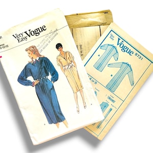 May include: Vintage Vogue sewing pattern, style 8731, with illustrations of a long-sleeve and short-sleeve dress. The pattern includes sizes 8-10-12. The cover art shows a woman in a blue dress and a woman in a beige dress.