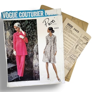 May include: Vintage Vogue Couturier Design sewing pattern featuring a Pucci of Italy design. The pattern packet shows a woman in a pink suit and another in a patterned coat. Includes pattern pieces and instructions.