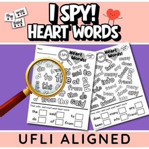 May include: Two educational worksheets titled I SPY! HEART WORDS with black text on white paper. A gold-rimmed magnifying glass is positioned over the left sheet. The pages feature lists of words like the, said, to, do, of, from, many, into, friend, does, and been, with empty boxes for counting.