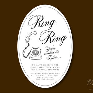 May include: An oval sign with a white background and black text featuring a line drawing of a rotary telephone. The text reads: Ring Ring, You've reached the Tylers, WE CAN'T COME TO THE PHONE RIGHT NOW, WE'RE BUSY GETTING MARRIED, PICK UP THE PHONE.