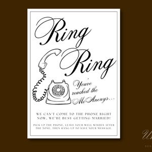 May include: A white rectangular sign with black text and a line drawing of a rotary telephone. The text reads: Ring Ring, You've reached the McAnenys... WE CAN'T COME TO THE PHONE RIGHT NOW, WE'RE BUSY GETTING MARRIED! PICK UP THE PHONE, LEAVE YOUR WELL WISHES AFTER THE TONE, THEN HANG UP TO SAVE YOUR MESSAGE.