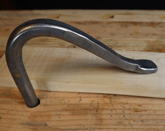Simple workbench holdfast, 3/4" or 1" hole.  Hand forged by Black Bear Forge
