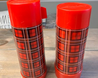 A. Vintage green plaid thermos by Sunshine (China). $16 B. Aladdin Quart  Thermos Stopper NO. 31 Cup NO. 243, 12 Tall Made in USA Red Plaid…
