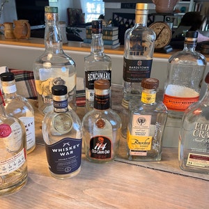Empty whiskey bottles, Buffalo Trace, Elijah Craig, Whiskey War, Buffalo Trace, Benchmark Bonded, Bulleit Bourbon Bottles Wedding